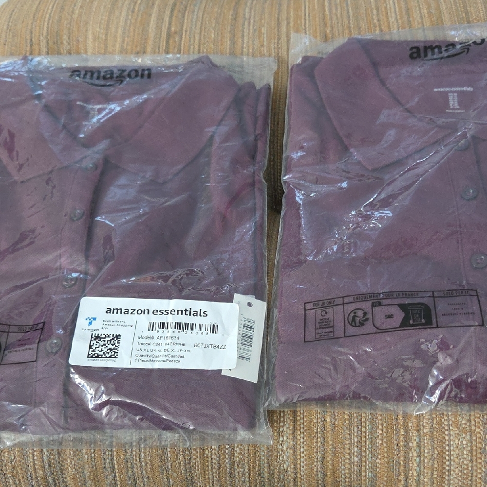 Two Maroon Polo shirts. They are short sleeved, with Three Button Front Closure.
